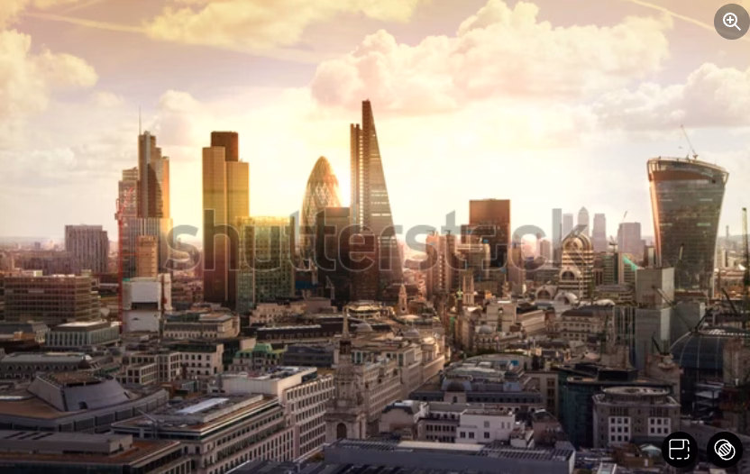 A panoramic view of the London skyline at sunset, featuring iconic skyscrapers such as The Shard, The Gherkin, and the Walkie Talkie building, with sunlight illuminating the cityscape.